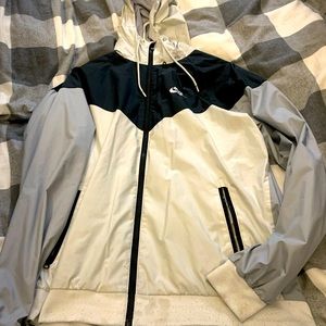 Nike windbreaker, very light weight. Man or woman wearable